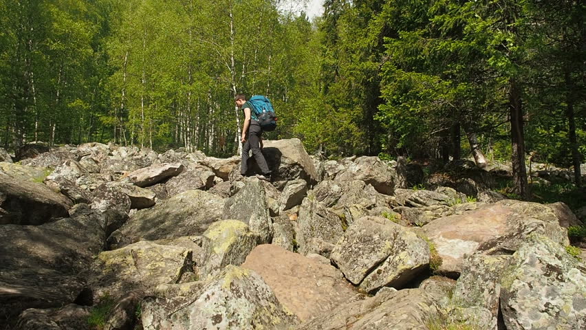 Hiker Man Hiking Walking Forest Cliffs. National Park in Russia Hiking Trail. Teen Travel Summer Vacation Hiking Trail. Tourist Man Travelling Sumer Hiking. Active Lifestyle Recreation Activity. 