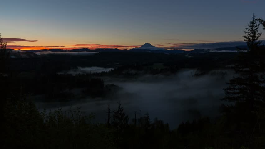Time lapse video of low moving fog over Sandy River with snow covered Mt. Hood from Jonsrud viewpoint at Sunrise one early morning in Oregon 4k UHD