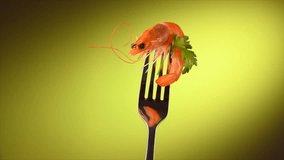 Shrimp. Fresh Prawn on a fork rotated on Green Background. Seafood, preparing healthy gourmet food, healthy eating, cooking, diet, nutrition concept. Slow motion 4K UHD video
