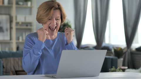 Excited Old Senior Woman Celebrating Success, Working on Laptop