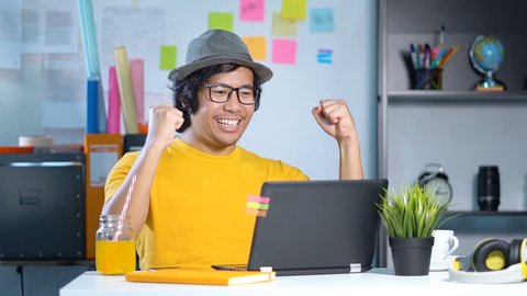 Excited Young Man Feels Satisfied Celebrating Success at Office Slow Motion