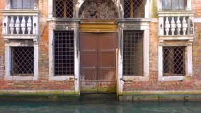Entry to neglected palace in Venice, Italy