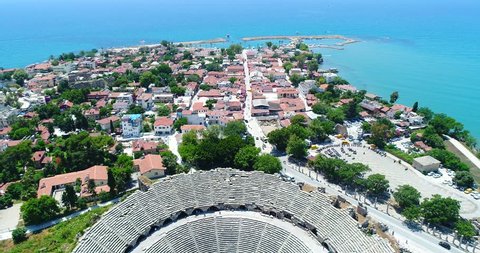 Aerial copter flight to old historic Antique Theater in Side, Turkey. Aerial view city of Side, Antalya.