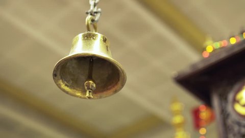 Close up of a Bell in a Hindu Temple. Moving in slow motion.