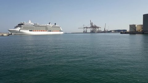 Malaga, Spain - June 25, 2018. Celebrity Reflection Cruise Ship leaving the docks from Malaga port, Andalucia, Spain, Western Europe. Time lapse
