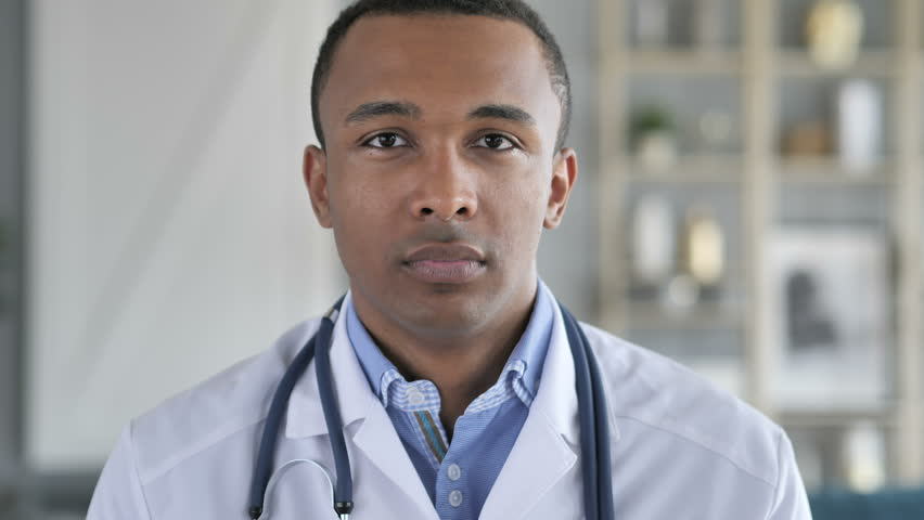 Portrait of Smiling Confident African-American Doctor Royalty-Free Stock Footage #1012793129