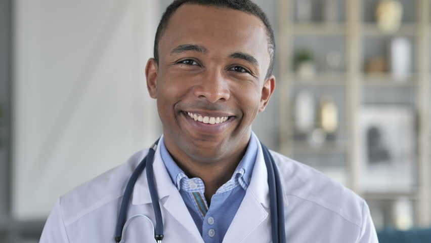 Portrait of Smiling Confident African-American Doctor | Shutterstock HD Video #1012793129