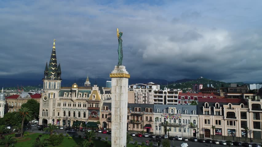 Batumi, Georgia - June 01 2018: Aerial view. Statue of the sorceress from the ancient Greek myth of the Golden fleece of Medea. Attraction in the center of Europe square in Batumi. | Shutterstock HD Video #1012803962