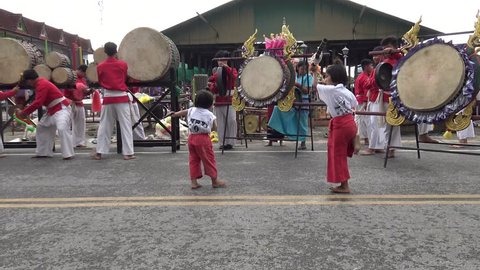 CHIANGMAI THAILAND MAY 12:Unidentified actor show hitting Sabatchai drum and children show knife dance in temple fair at Klangweang Temple Prao District on May 12, 2018 Chiangmai Thailand.