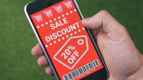 Swiping trough many discount coupons to save money on a smartphone device.