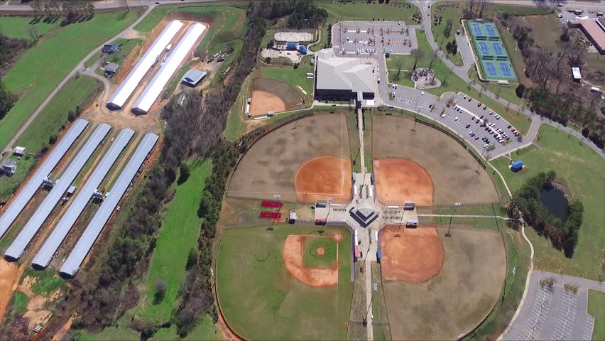 Public park baseball field road traffic. Aerial.