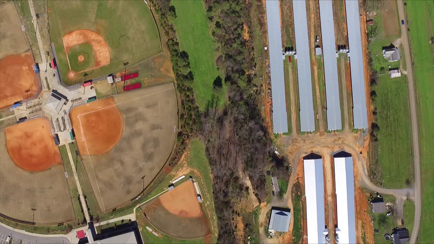 Baseball field chicken coops. Aerial flyover.