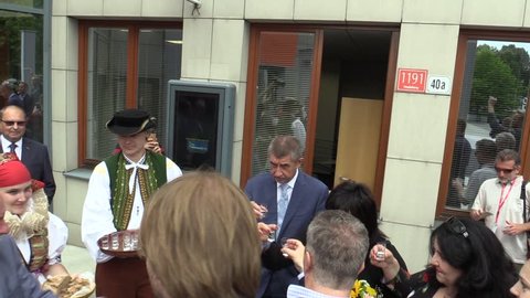 OLOMOUC, CZECH REPUBLIC, MAY 15 , 2018: Czech Prime Minister Andrej Babis comes in Olomouc Region, man and woman in traditional Hana costume, welcomed bread with salt and alcohol plum liquor slivovitz