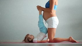 Video pregnant woman practicing yoga with your child
