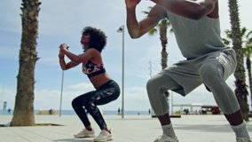 Black couple doing exercise outdoors - Powered by Shutterstock - Get 15% off with code: PIKWIZARD15