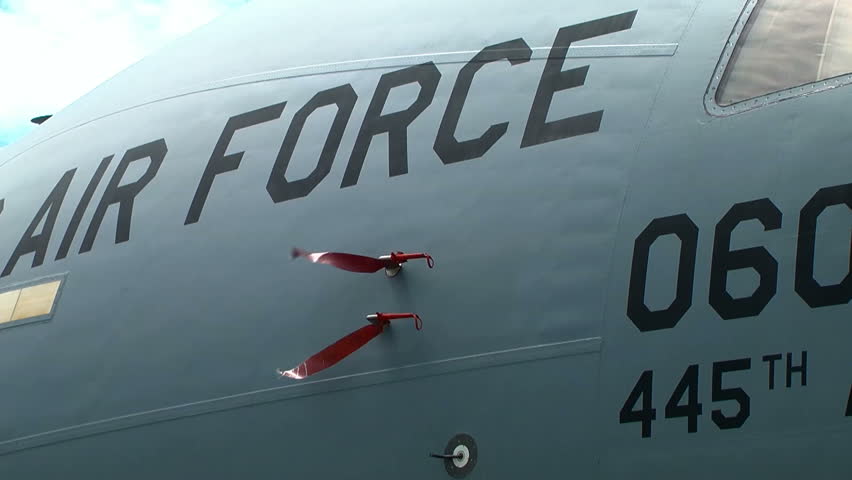 Fuselage of large US Air Force cargo aircraft C-17.  Remove before flight red flags banners streamers move in the breeze. Royalty-Free Stock Footage #1012852130