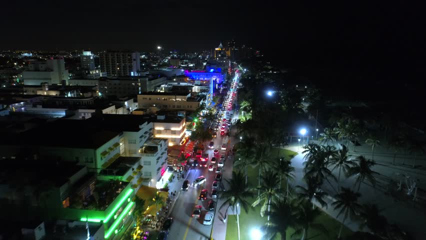 Drone footage South Beach Ocean Drive night neon