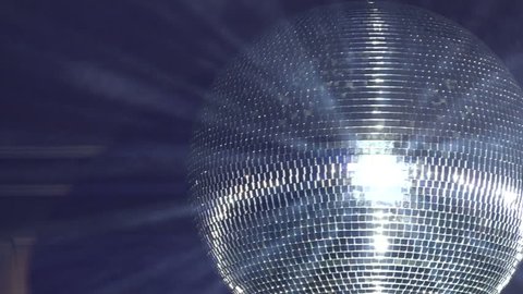 Rotating disco mirror ball. Rotating sparkling disco ball. Concept of night party.