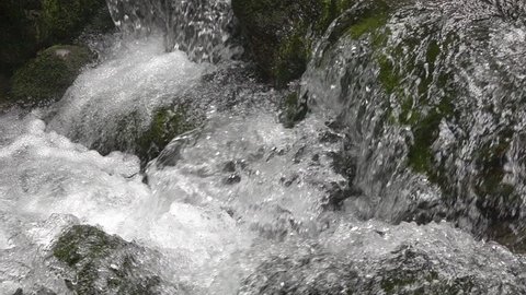 Detail of waterfall on mountain stream. Slow motion 10x.