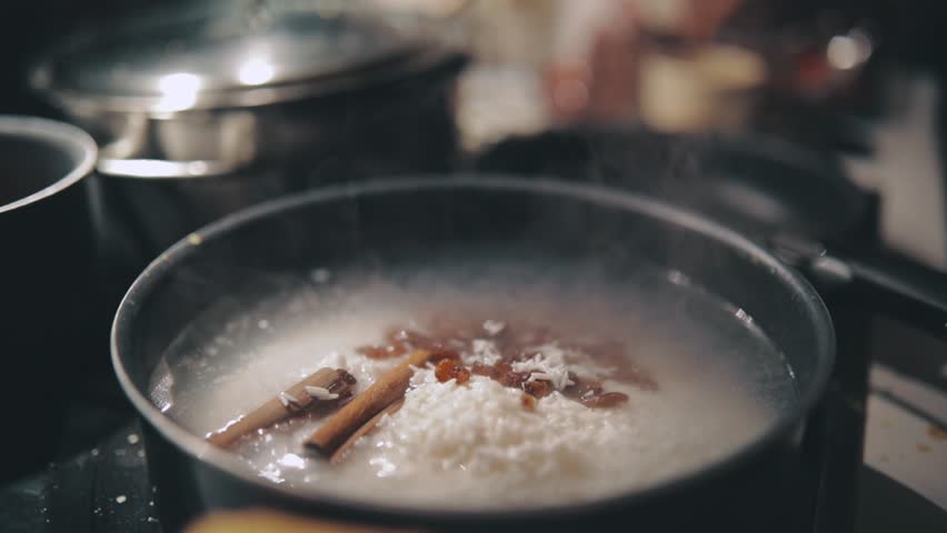 Boiling Rice with Cinnamon Sticks and Star Anise for Indian Home Party Dinner | Shutterstock HD Video #1012879304