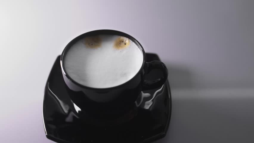 Cup of Coffee. Stirring with spoon. Close up of a beautiful coffee. Stirring with spoon. 