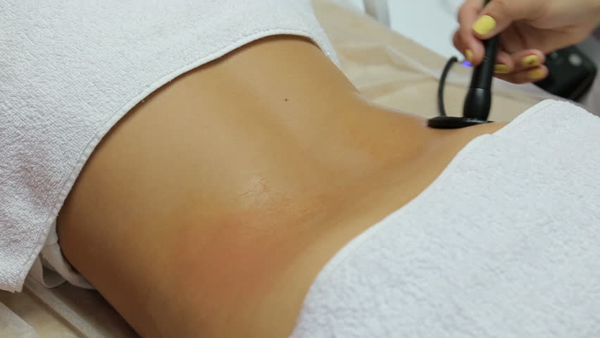 Woman getting anti cellulite therapy in beauty salon. RF lifting
