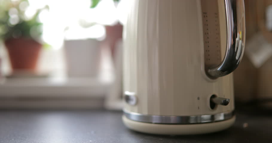 Establishing shot of a Kettle being turned on to boil. Royalty-Free Stock Footage #1012887842