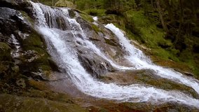 Slow motion video of Waterfall Riessloch, Bodenmais. Biggest cascade in National park Bayerischer Wald. Amazing scenery from Bavaria, Germany.
