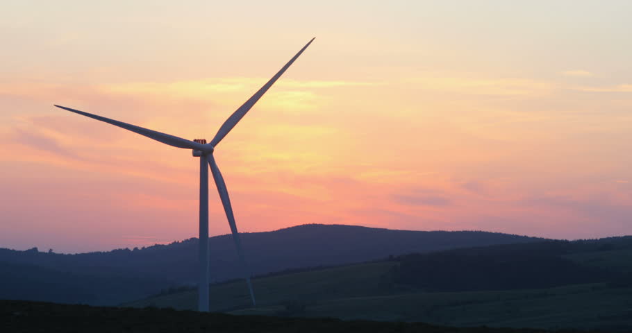 Scenic landscape view of wind turbines blades rotating with pink purple twilight sky on background fiery sunset kinetic energy electricity ecology lifestyle peaceful rural area eco-business trend | Shutterstock HD Video #1012903679