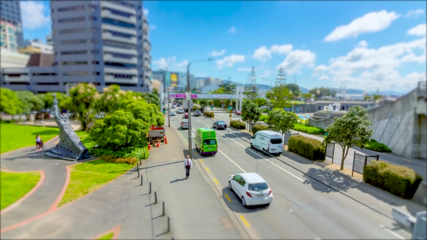 Wellington City, capital of New Zealand. Tilt shift time lapse of traffic driving past the lagoon.