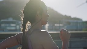 beautiful caucasian woman athlete running on city street training intense cardio endurance workout focused female runner wearing earphones urban morning sunrise slow motion - Powered by Shutterstock - Get 15% off with code: PIKWIZARD15
