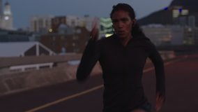 young strong woman athlete running sprinting fast resting after intense training run in urban city evening female power - Powered by Shutterstock - Get 15% off with code: PIKWIZARD15
