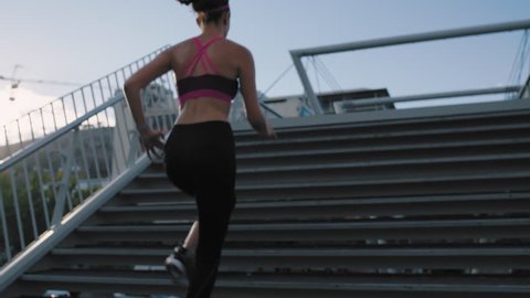 woman athlete legs running up stairs training intense cardio workout exercise female runner feet jogging in urban city background background