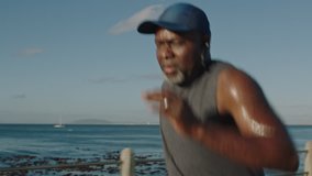 african american man running black male runner exercising jogging healthy fitness workout lifestyle in ocean seaside background close up - Powered by Shutterstock - Get 15% off with code: PIKWIZARD15