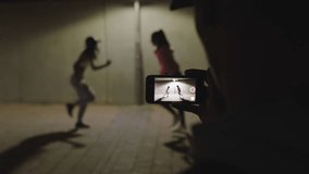 dancing woman happy hip hop dancer girls dance under street light friend using smartphone taking video enjoying sharing on social media in city at night