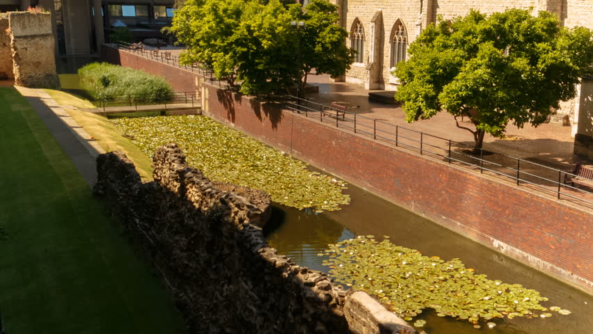 Tilting shot featuring a Roman Fort and the St Giles Cripplegate Church in the Barbican area of the London Wall, England, UK