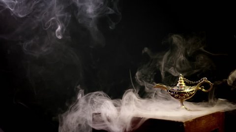 Aladdin Lamp on a table with smoke in the air.