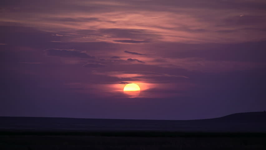 Amazing scarlet sunset in clouds.