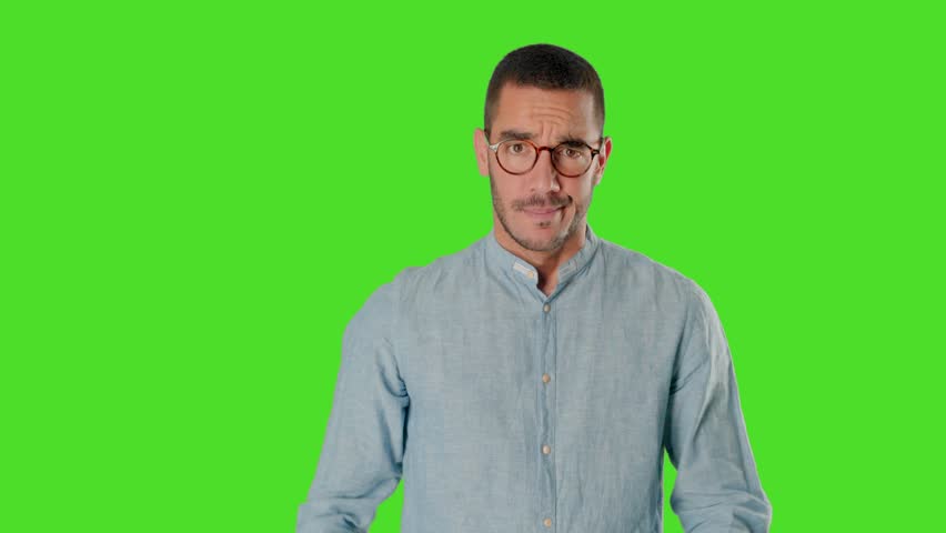 Concerned young man on chroma screen with a gesture of concentration