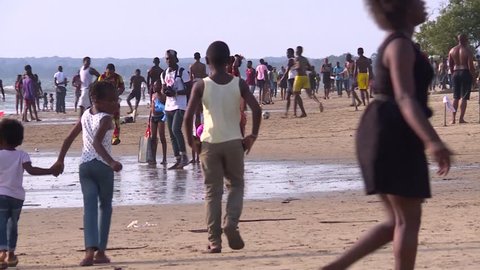 Libreville, Gabon - 01 07 2017: Sunny afternoon on the beach of Libreville. people are having fun, meeting each other and enjoying the moment.