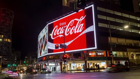 SYDNEY, AUSTRALIA - JUNE 27, 2018 Time lapse footage of the Coca-Cola advertising billboards at the intersection of William St. and Darlinghurst Road in Kings Cross, Sydney.