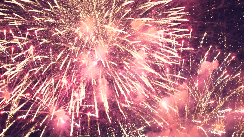 Explosions fireworks against the background of the night sky. Colorful big shiny fireworks in the glowing show. New Year's Eve fireworks celebration. 4th independence day and new year. 4 July | Shutterstock HD Video #1012997258