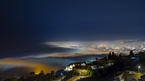 Beautiful Time lapse of a foggy night, over the see at Fuengirola and Mijas. It was shot from the Stupa of Benalmadena over the mountains during 2 hours.