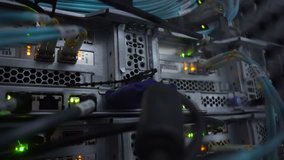 4K. Optical server working dark data servers. Blinking led green lamps. CloseUp. The video contains a little noise
