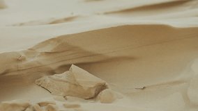Wind blowing sand and forming geometrical shapes in a dune. Telephoto lens shot (500mm) Joaquina beach. Florianópolis, Santa Catarina / Brazil - Powered by Shutterstock - Get 15% off with code: PIKWIZARD15