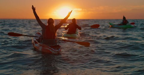 a beautiful dawn in the sea on kayaks. in slow motion