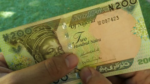 Authentication of Nigerian banknote by hand