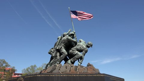 WASHINGTON, DC - APR 2015: Iwo Jima Memorial Marine Corp flag Washington DC 4K. Entrance to Arlington National Cemetery. Over 400,000 graves in cemetery. Dedicated to United States Marine Corps.