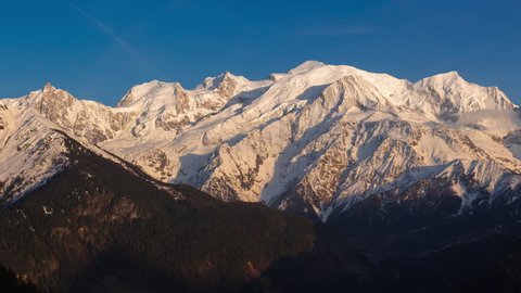Panoramic view of the Mont Blanc mountain range. Timelapse from twilight to sunset. The view includes Aiguille du Midi needle, Mont Blanc du Tacul and Mont Blanc. Chamonix, Haute-Savoie, France