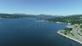 4K aerial footage over the river Clyde towards Helensburgh Sailing Club, and Rhu Marina.